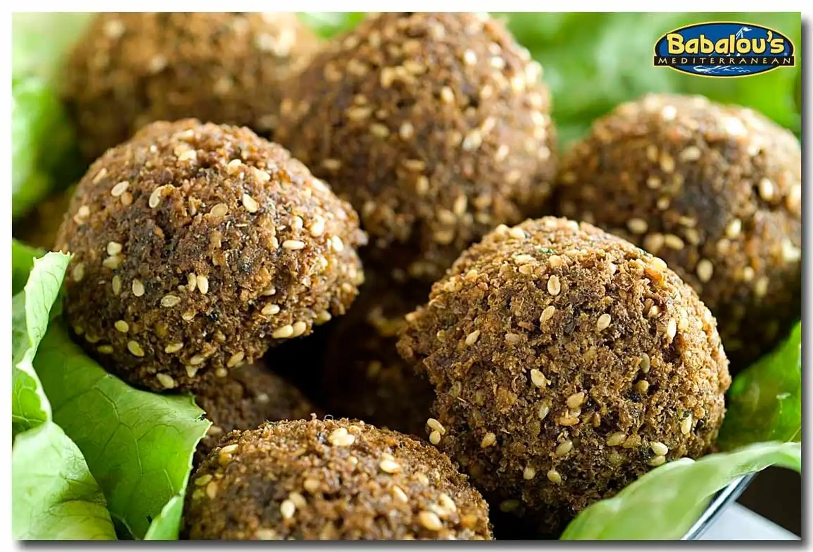 Sesame-studded falafel on fresh lettuce